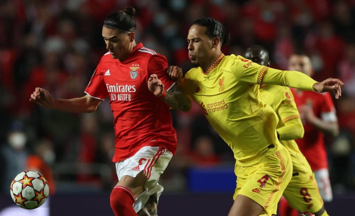 Benfica striker Darwin Nunez tussling with Liverpool defender Virgil van Dijk