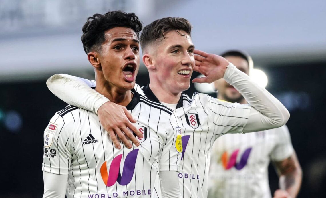Fabio Carvalho celebrates with Fulham teammate Harry Wilson duing Sky Bet Championship clash at Craven Cottage