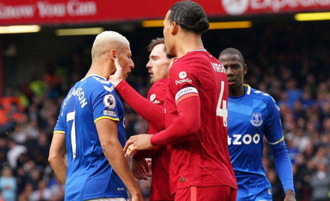 Richarlison squares up to Liverpool players in the Merseyside derby.