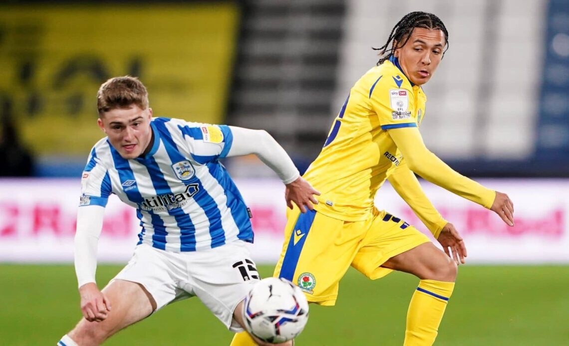 Ian Poveda battles for the ball with Huddersfield Town's Josh Ruffels during the Sky Bet Championship match at The John Smith's Stadium, Huddersfield