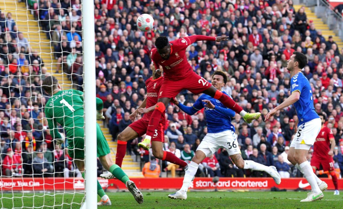 Liverpool striker Divock Origi heads in a goal