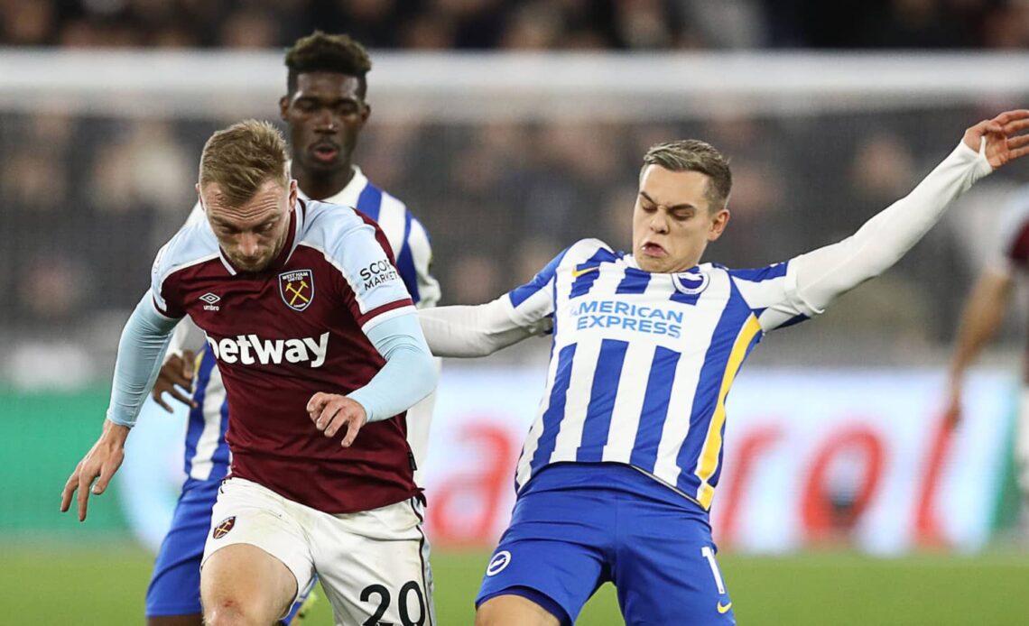 West Ham attacker Jarrod Bowen tussling with Brighton forward Leandro Trossard