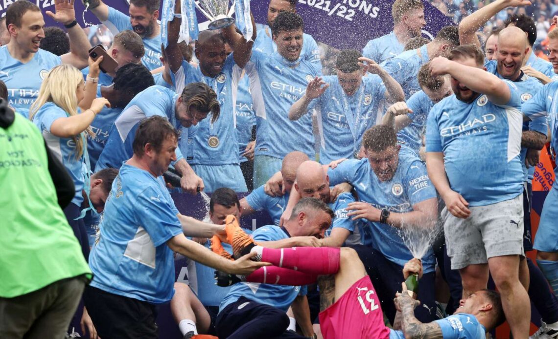 Manchester City players celebrate winning the 2021/22 Premier League title after a 3-2 win over Aston Villa