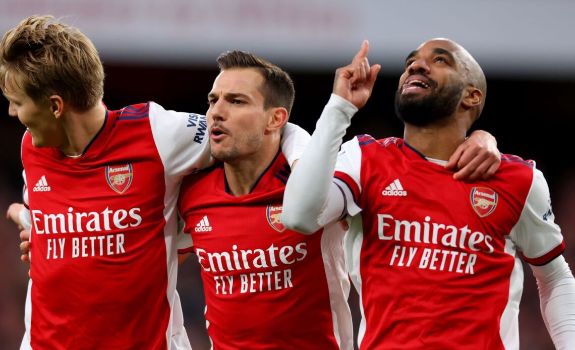Alexandre Lacazette of Arsenal celebrates with Cedric Soares and Martin Odegaard after he scores a penalty against Leicester