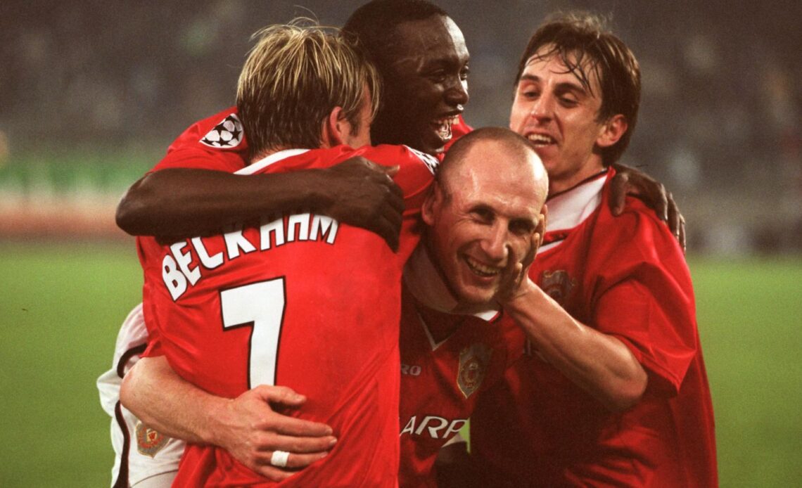 Man Utd duo Gary Neville and Jaap Stam celebrate a goal