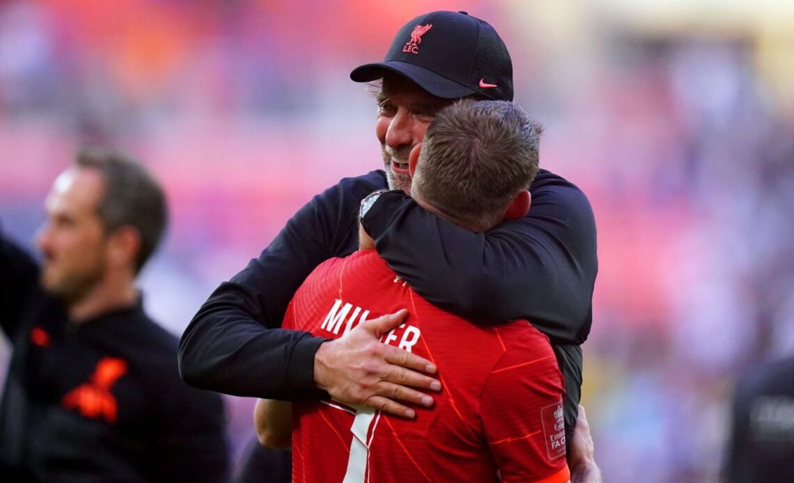 Liverpool duo Jurgen Klopp and James Milner hug each other