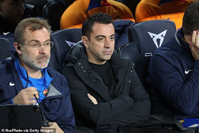 Barcelona manager Xavi (right) wants Lewandowski to help his squad chase down Real Madrid