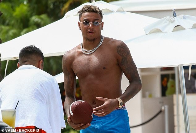 Former Man United star Jesse Lingard has been spotted with an American football on holiday