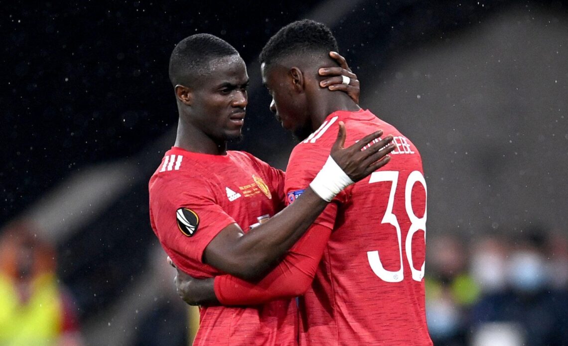 Eric Bailly hugs Axel Tuanzebe