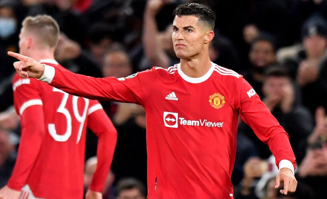 Man Utd striker Cristiano Ronaldo points instructions to his team-mates