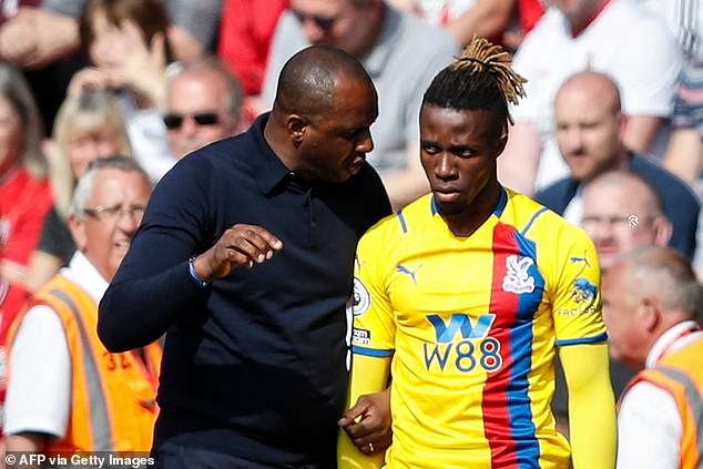 Palace boss Patrick Vieira (left) could opt to sell Zaha this summer if his contract isn't extended
