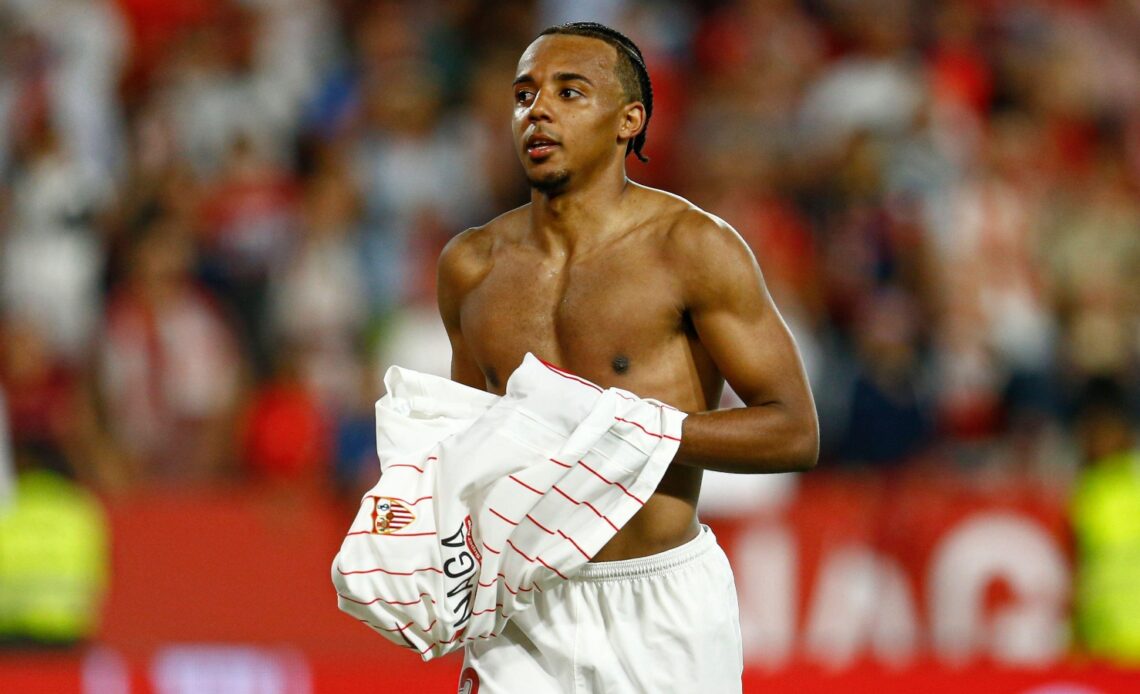 Chelsea target Jules Kounde takes his shirt off after a match