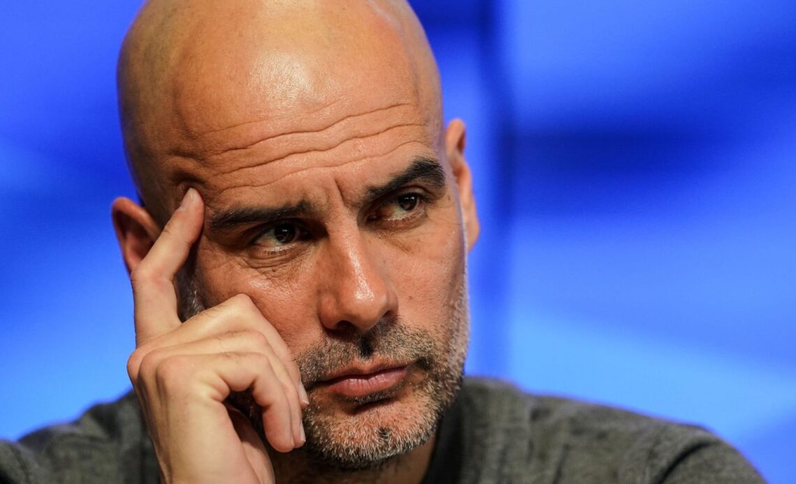 Pep Guardiola looks serious