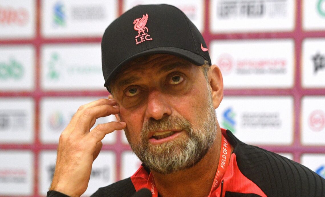 Liverpool boss Jurgen Klopp scratches his face