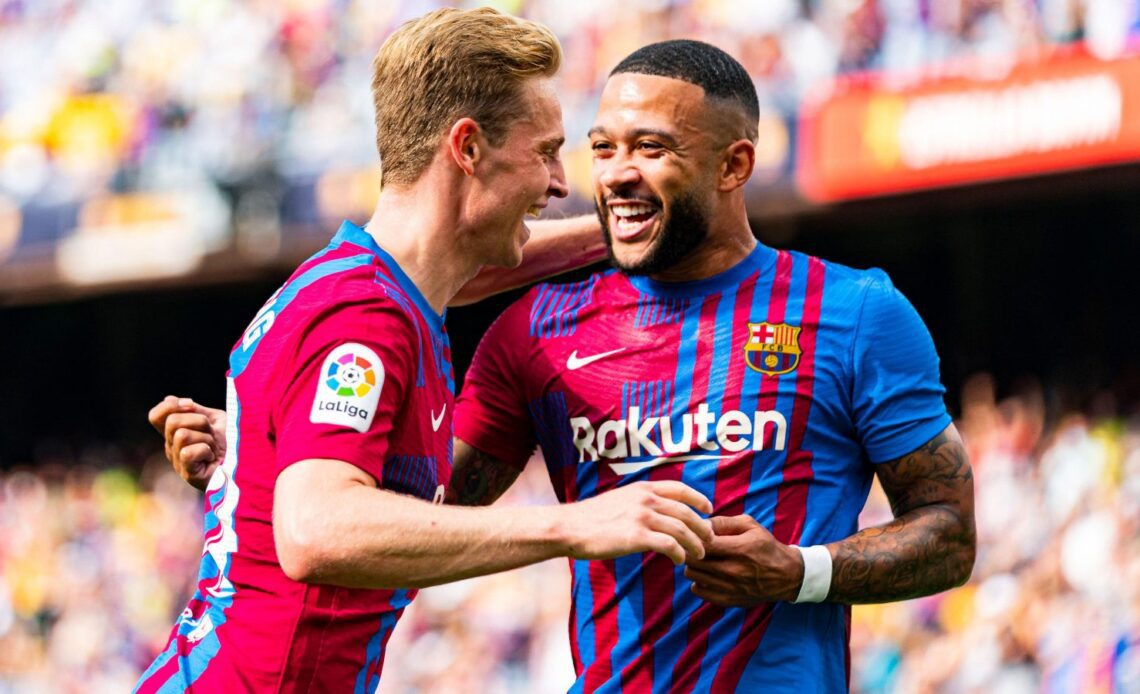 Memphis Depay celebrates with Frenkie de Jong after scoring for Barcelona.