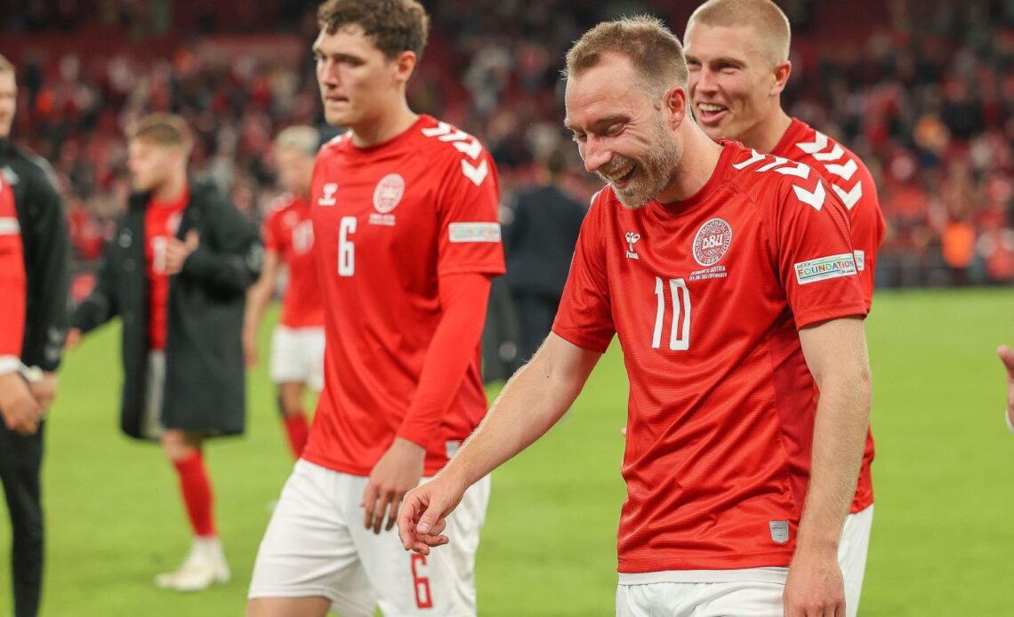 Man Utd target Christian Eriksen laughs with a team-mate