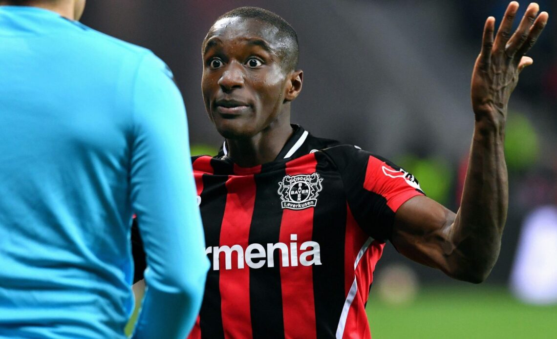 Bayer Leverkusen winger Moussa Diaby in discussion with a referee.