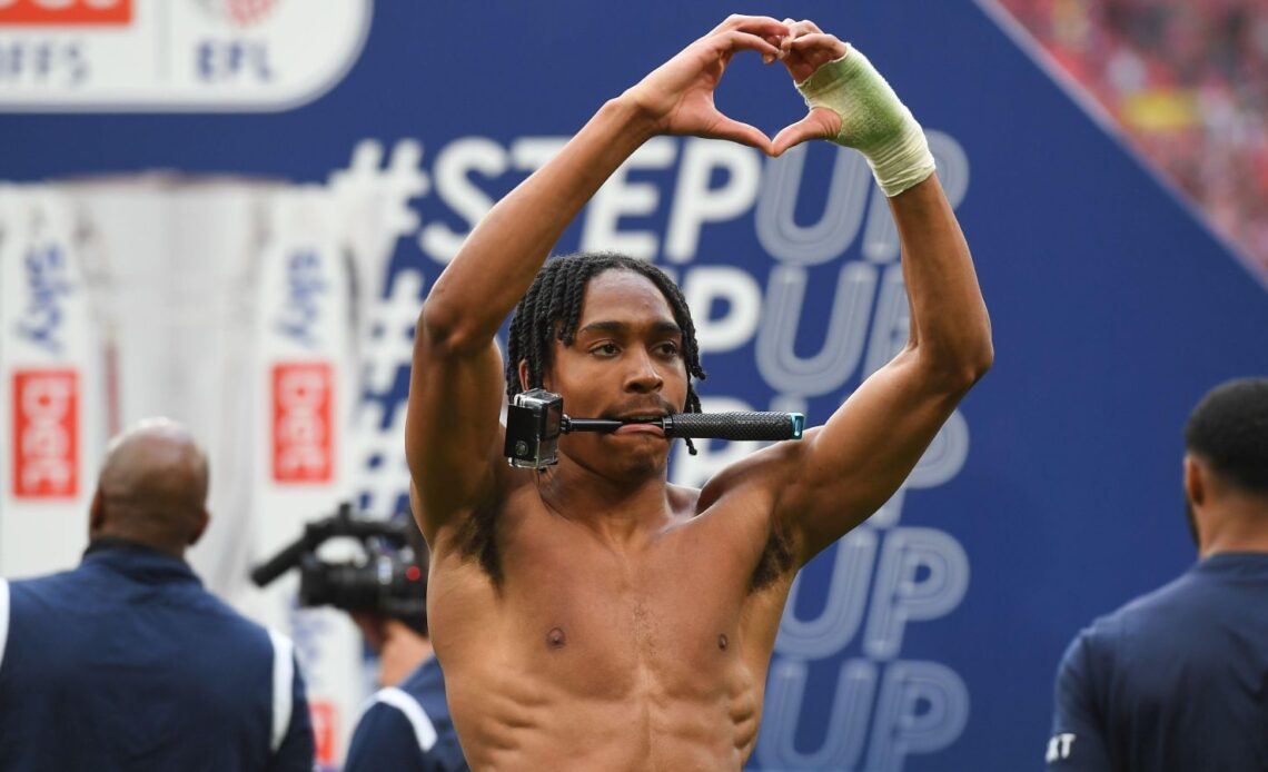 Tottenham target Djed Spence makes a heart sign to the fans