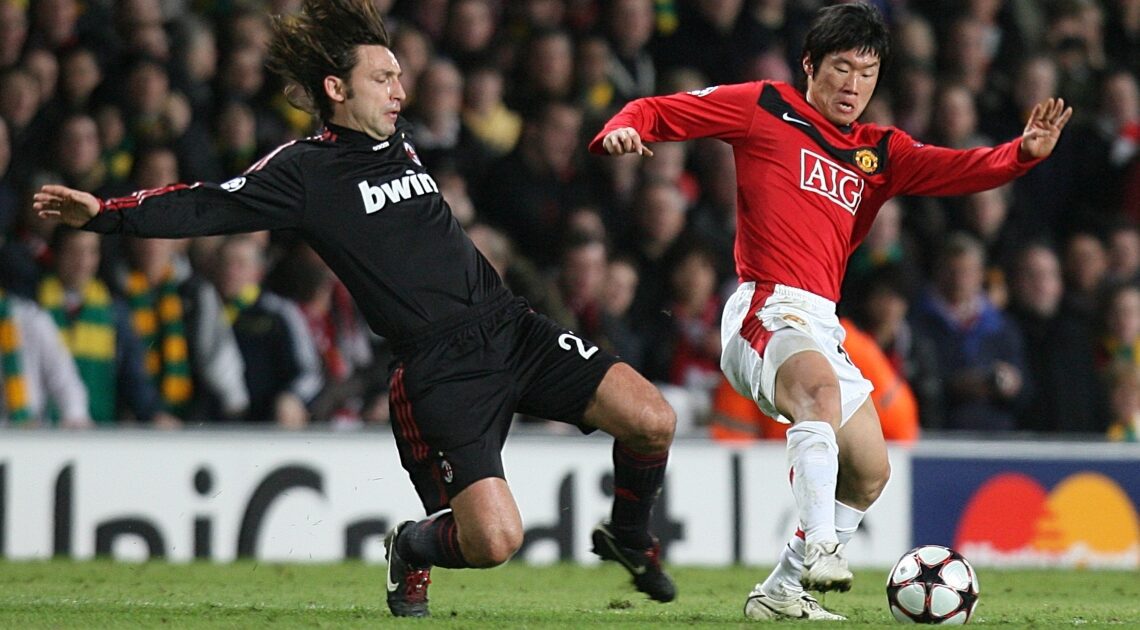 Park Ji-sung of Manchester United and Andrea Pirlo of AC Milan. Old Trafford, Manchester, February 2010.