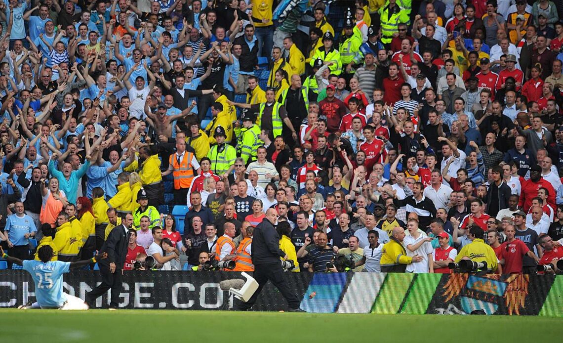 Emmanuel Adebayor celebrates in front of Arsenal fans after scoring against his former club for Manchester City
