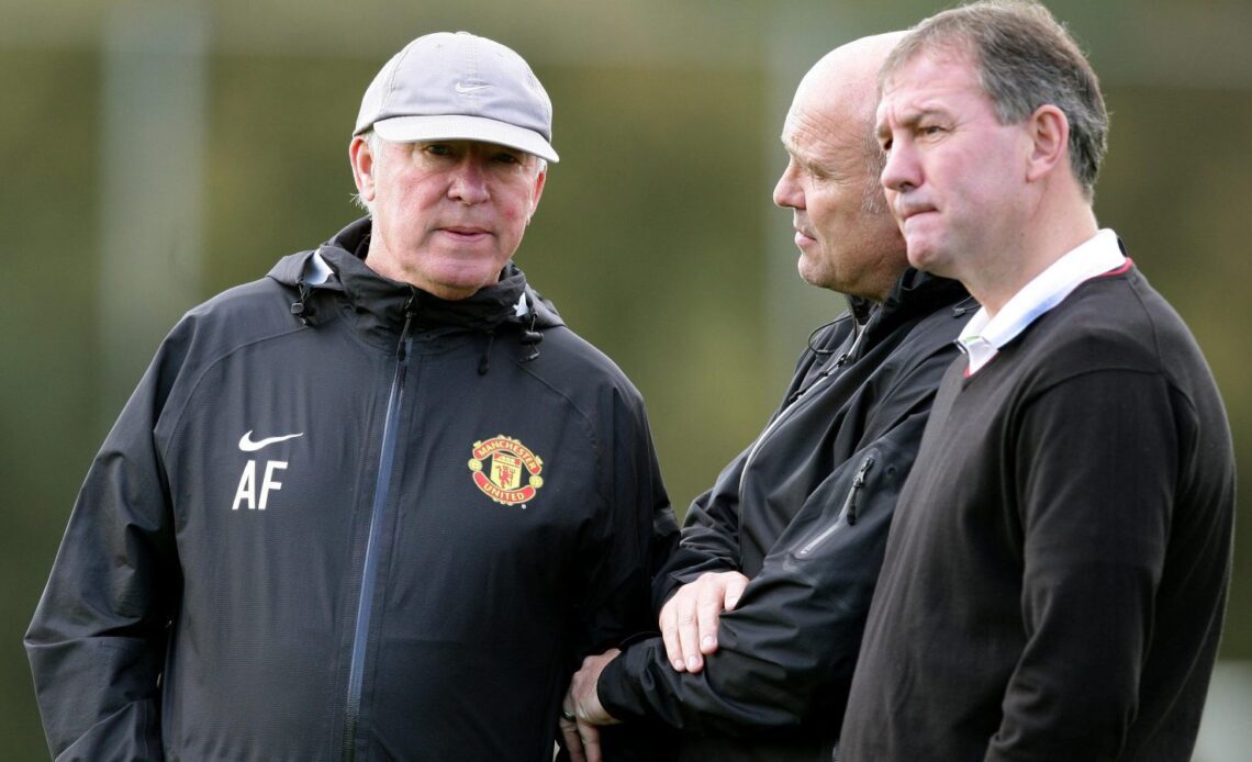 Sir Alex Ferguson and Bryan Robson in discussion at Manchester United training.