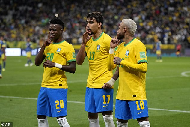 The midfielder (centre) celebrates a goal for Brazil with Neymar (right) and Vinicius Junior