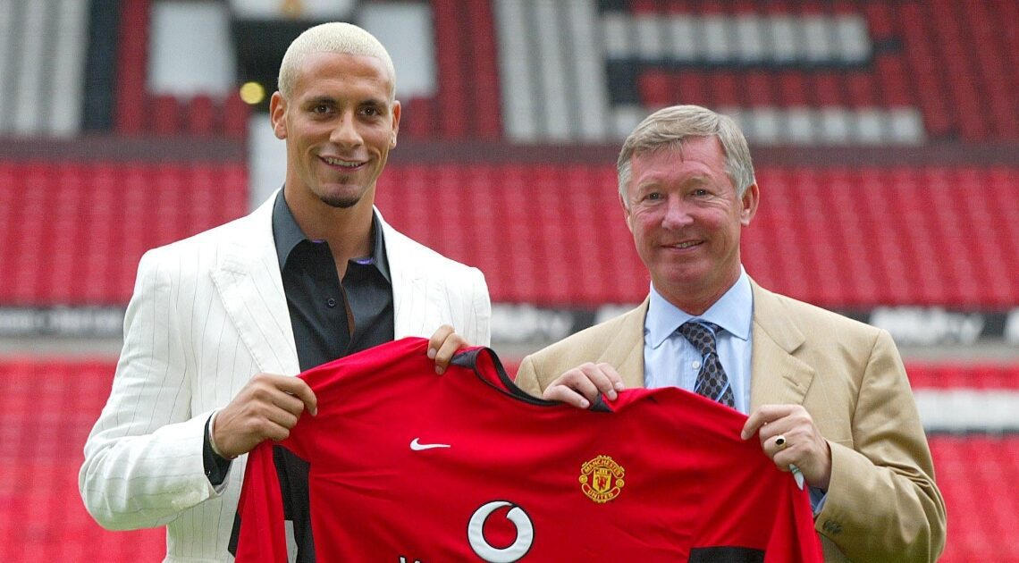 Sir Alex Ferguson and Rio Ferdinand pose with a Manchester United shirt at Old Trafford, Manchester, England. July 2002.