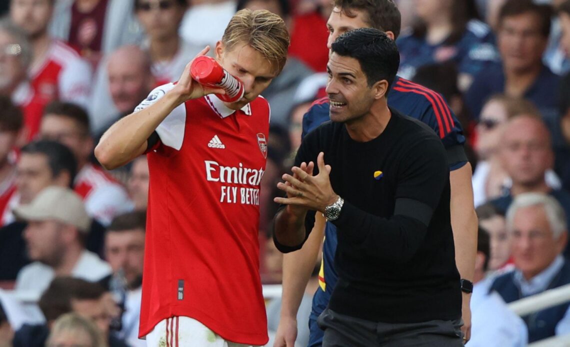 Arsenal boss Mikel Arteta talks to Martin Odegaard