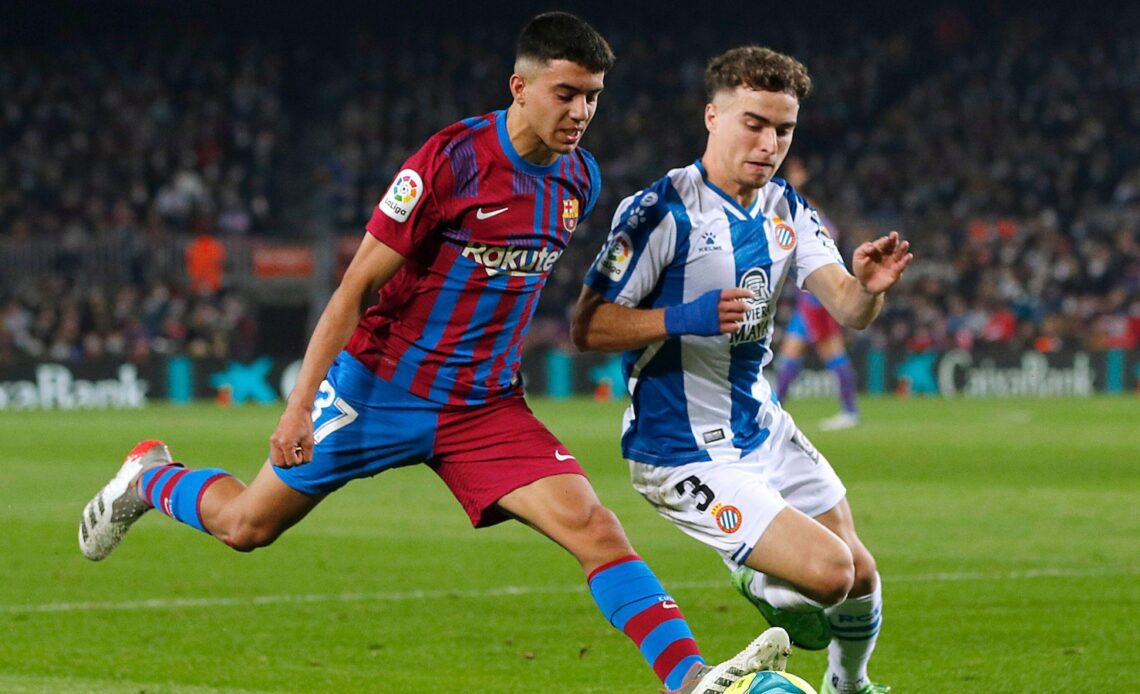 Reported Newcastle and Brighton target Adria Pedrosa defending a Barcelona player