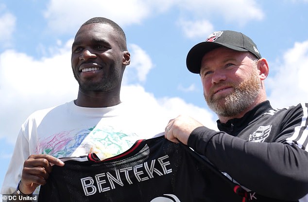 Benteke could not turn down the opportunity to sign for soccer legend Wayne Rooney (right)
