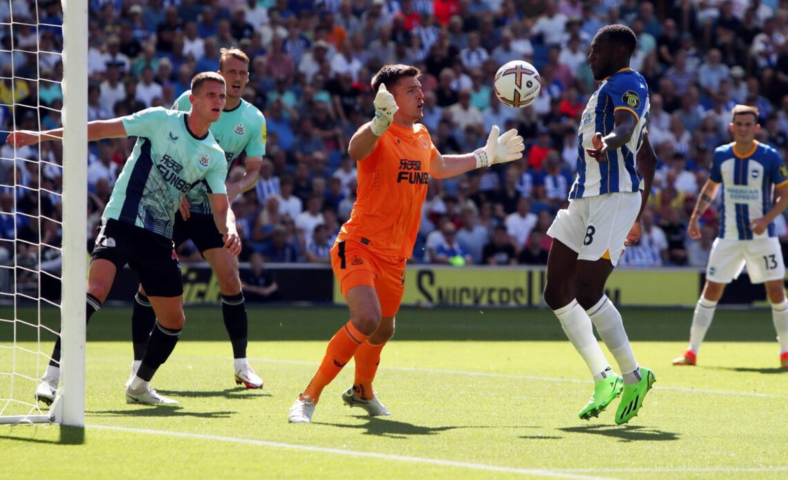 Newcastle keeper Nick Pope saves from Brighton striker Danny Welbeck.