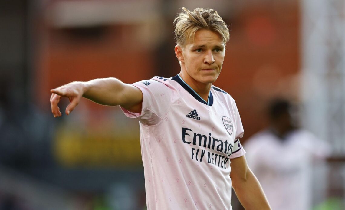 Arsenal captain Martin Odegaard points the way to his team-mates