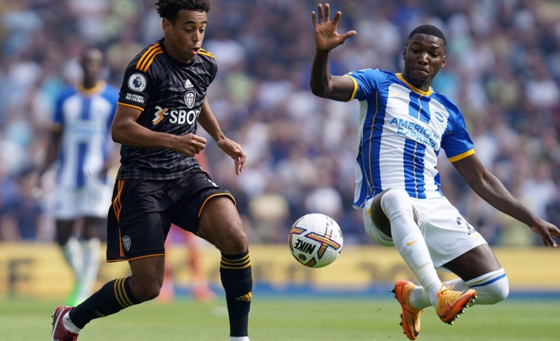 Brighton midfielder Moises Caicedo tackles Leeds United's Tyler Adams.