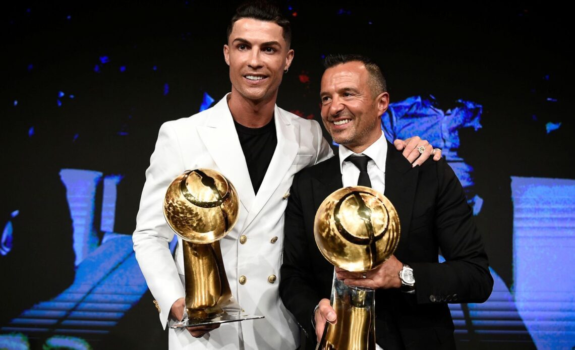 Man Utd striker Cristiano Ronaldo and his agent Jorge Mendes hold awards