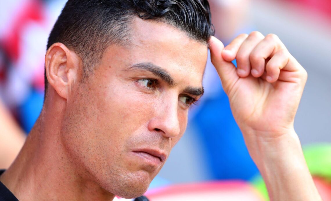 Man Utd striker Cristiano Ronaldo looks unhappy on the bench