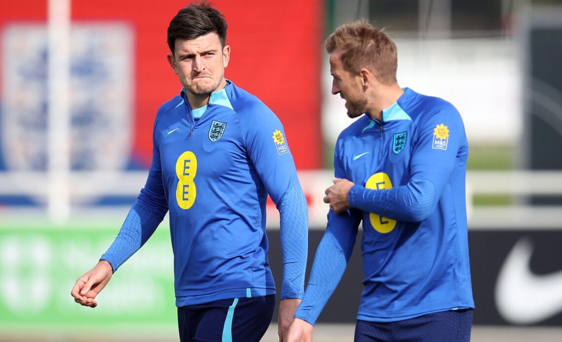 Harry Maguire chats with Harry Kane during England training.