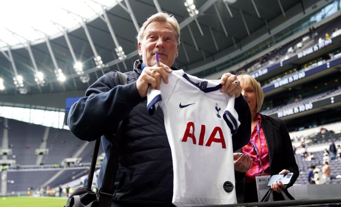 Glenn Hoddle preparing to sign a Tottenham shirt