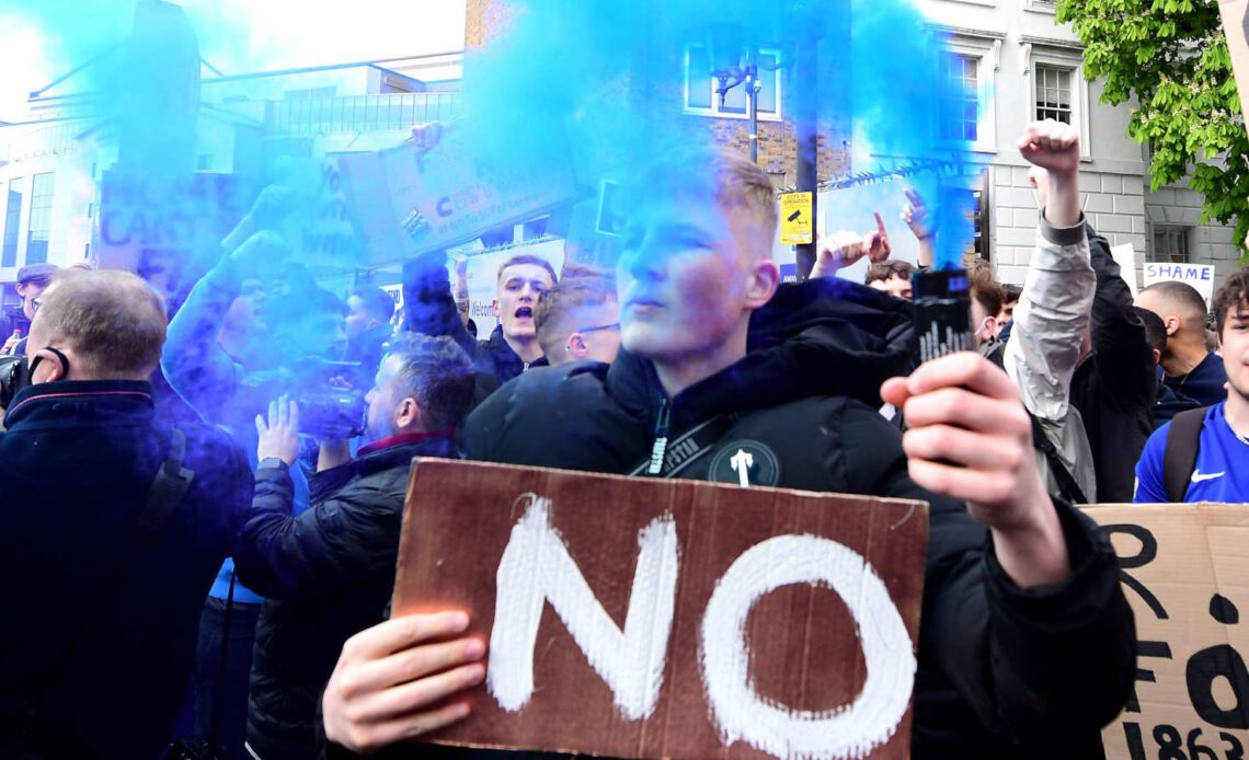 A fan protests Premier League involvement in th European Super League