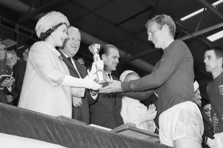 The Queen presenting Bobby Moore with the World Cup in 1966