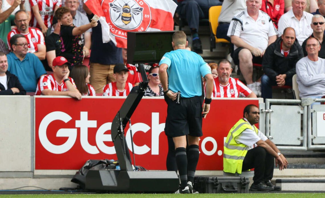 Referees under scrutiny: checking VAR during the match between Brentford and Leeds