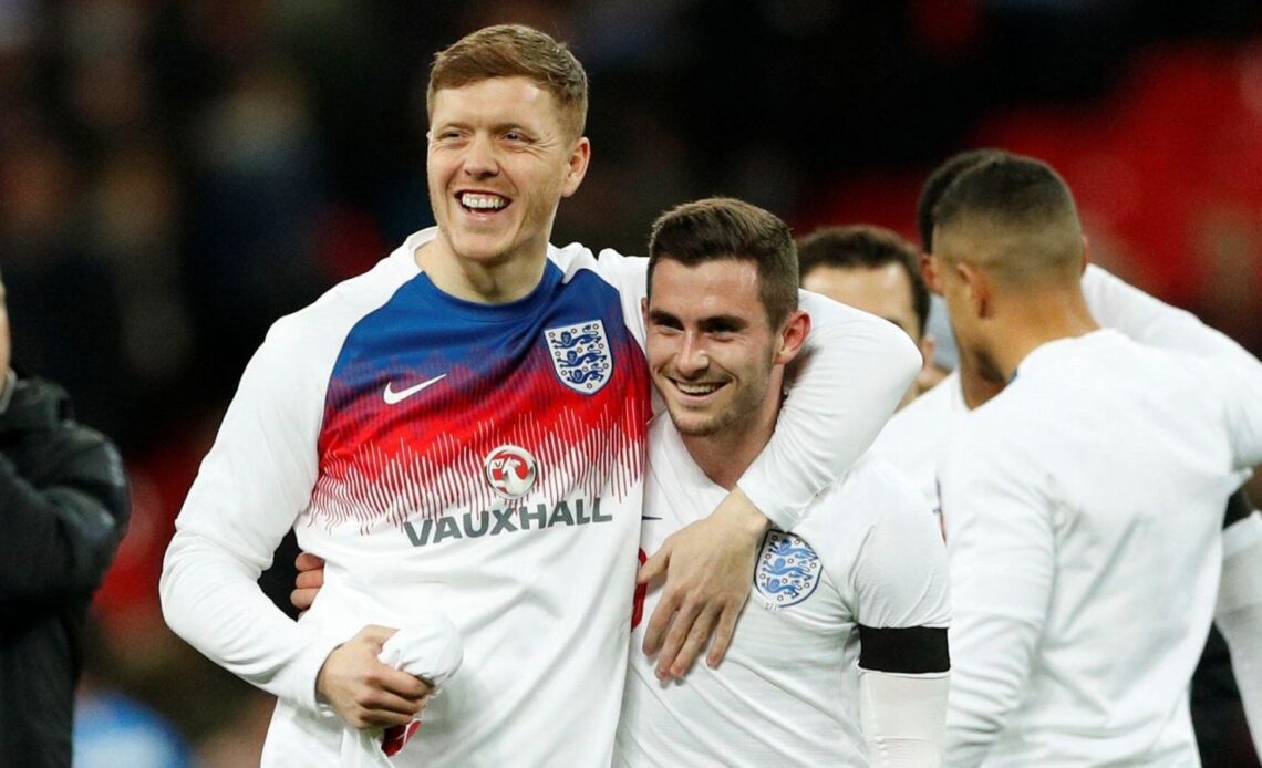Alfie Mawson and Lewis Cook embrace after an England friendly against Italy in 2018