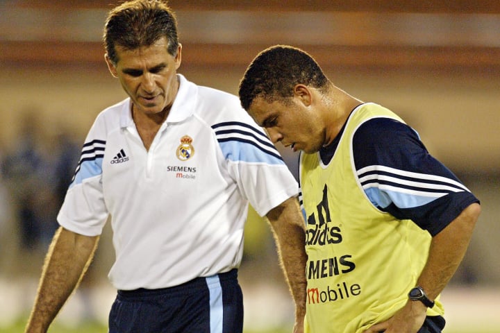 Real Madrid's Ronaldo (R) talks with hea