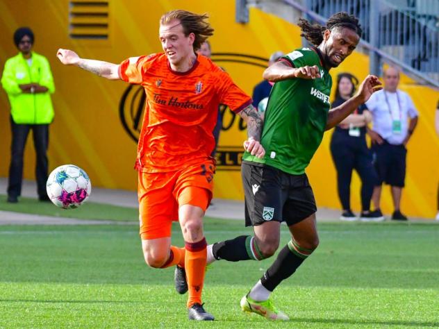 Forge FC defender Alexander Achinioti-Jönsson (left)