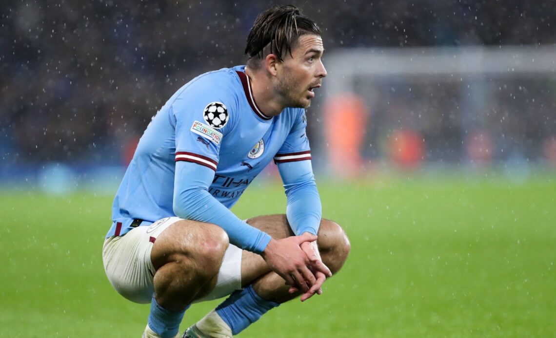 Jack Grealish squats during a match