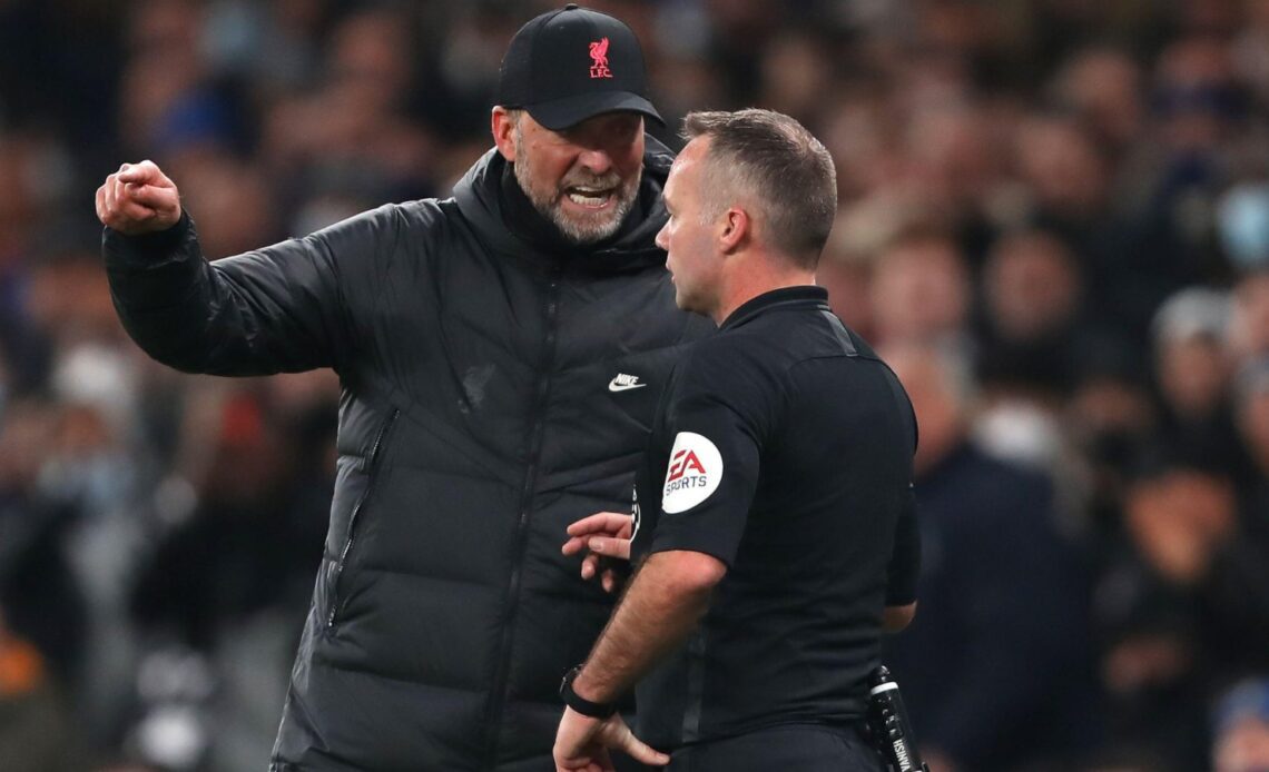 Liverpool manager Jurgen Klopp chats with referee Paul Tierney.