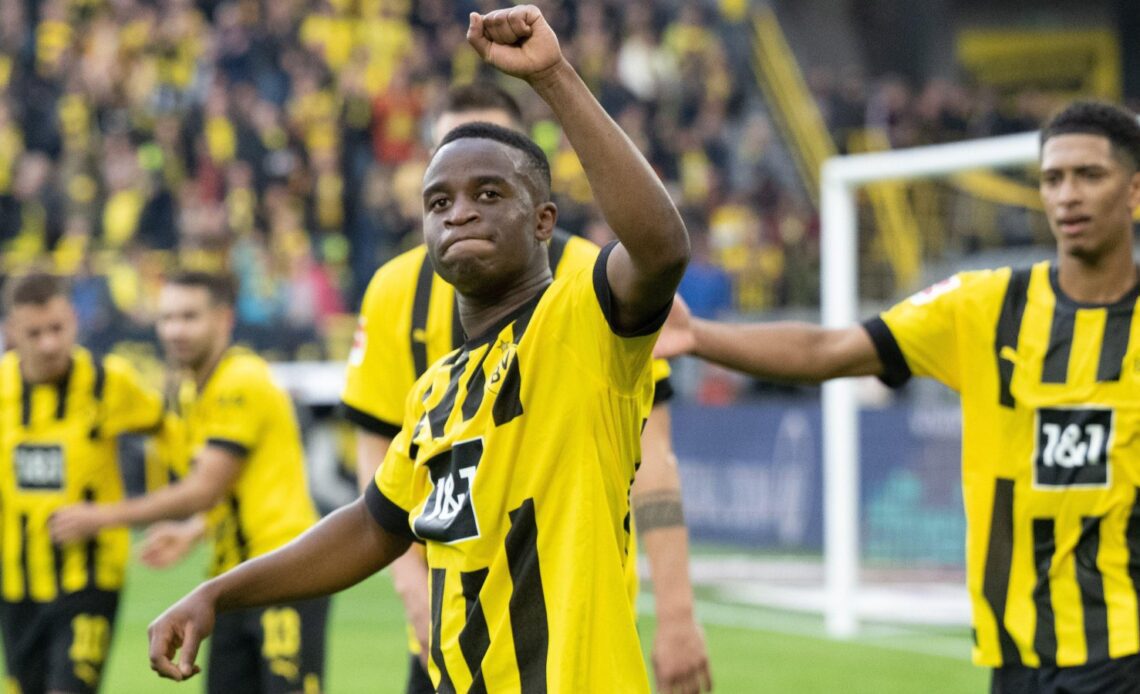 Youssoufa Moukoko celebrates scoring for Borussia Dortmund.