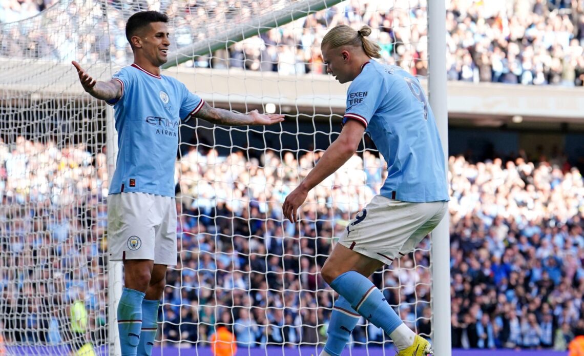 Man City duo Joao Cancelo and Erling Haaland celebrate a goal