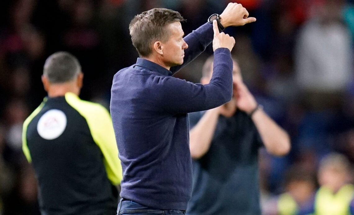 Leeds manager Jesse Marsch points to his watch.