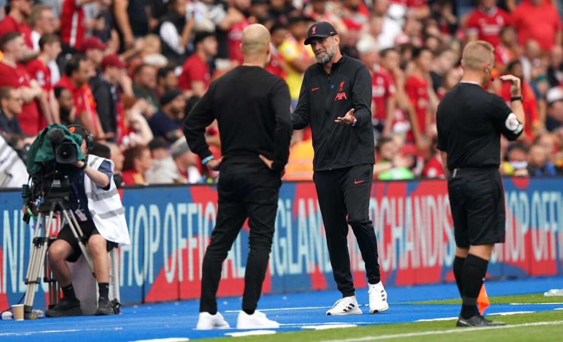 Liverpool boss Jurgen Klopp and Pep Guardiola speak on the touchline