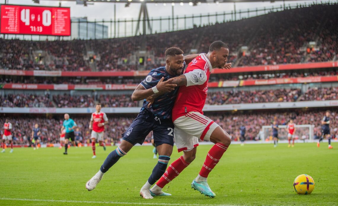 Arsenal defender Gabriel shields the ball against Emmanuel Dennis